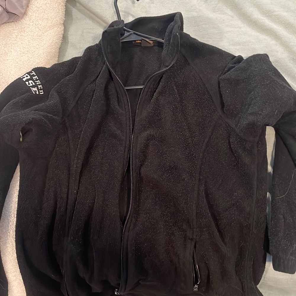 fleece plain pblack with Registered Nurse written on the right arm